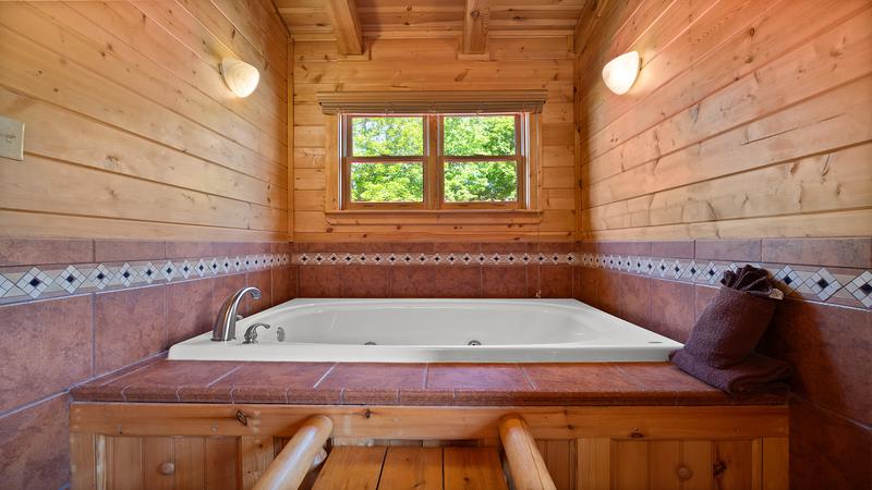 Jacuzzi tub in your Smoky Mountains cabin's fourth bedroom.